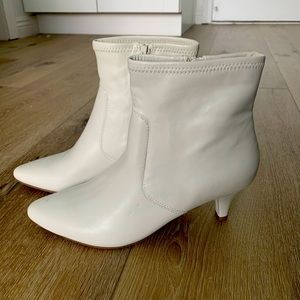 White faux leather booties with kitten heel